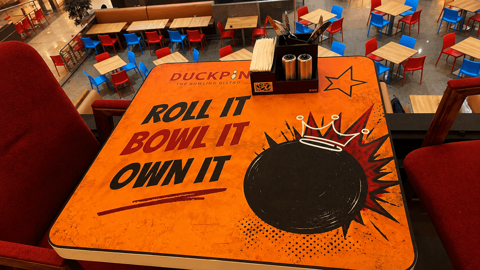 Branded Booth Table Overlooking the Food Court